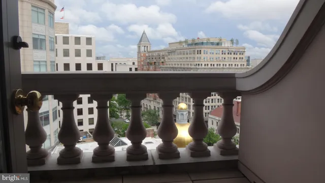 a view of a balcony with chairs