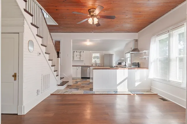 a view of a living room with a fireplace