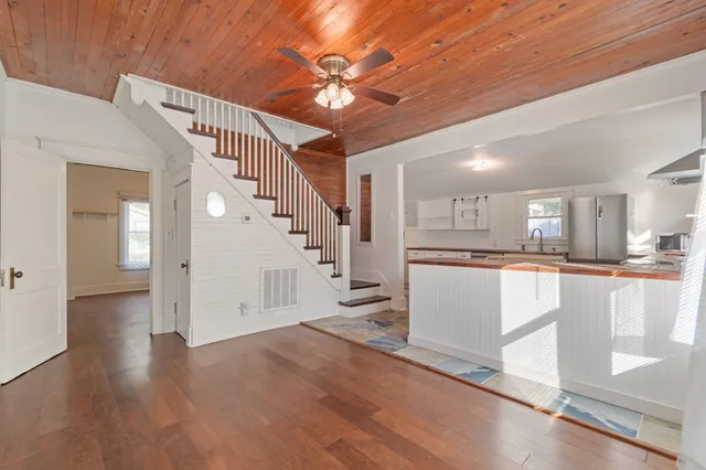 a view of kitchen with cabinets and wooden floor