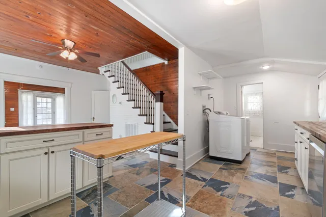a view of a kitchen with furniture and window
