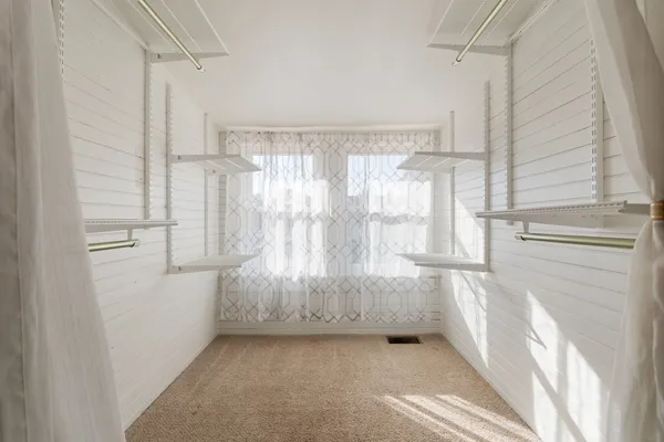 a view of bathroom with bathtub and shower