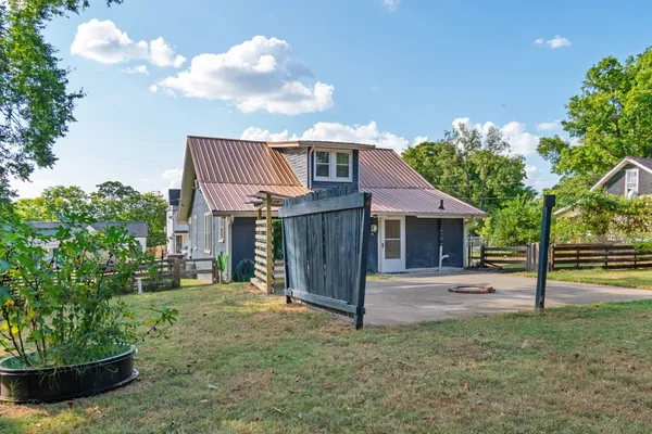 a view of a house with a back yard