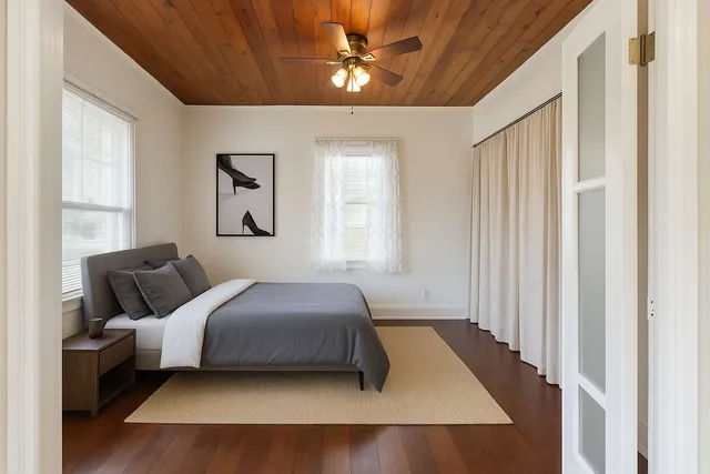 a bedroom with bed and window