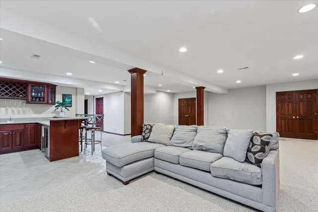a view of a house with backyard porch and sitting area