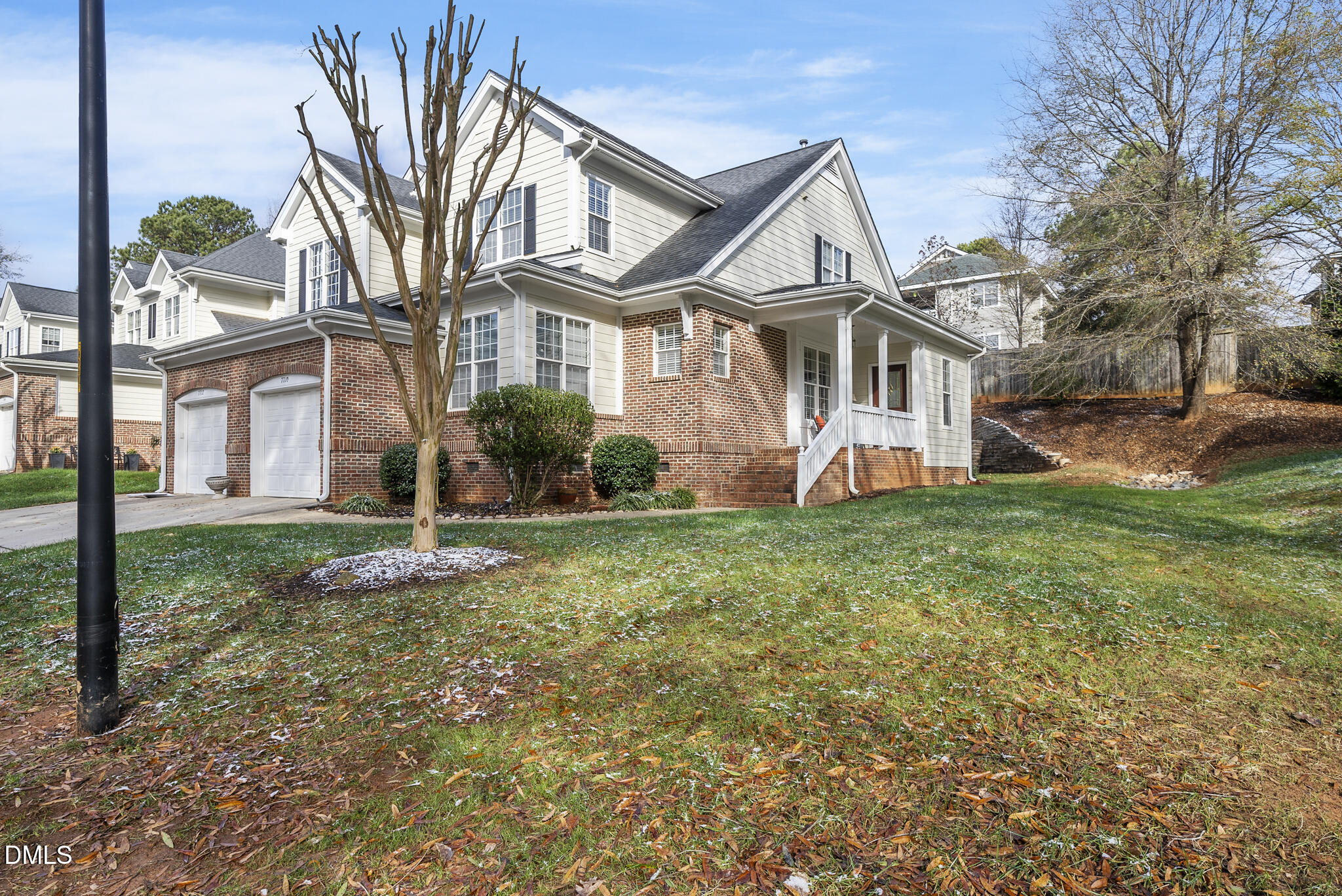7710 Astoria Place Raleigh, NC 27612 - Photo 2 of 34 a front view of a house with garden