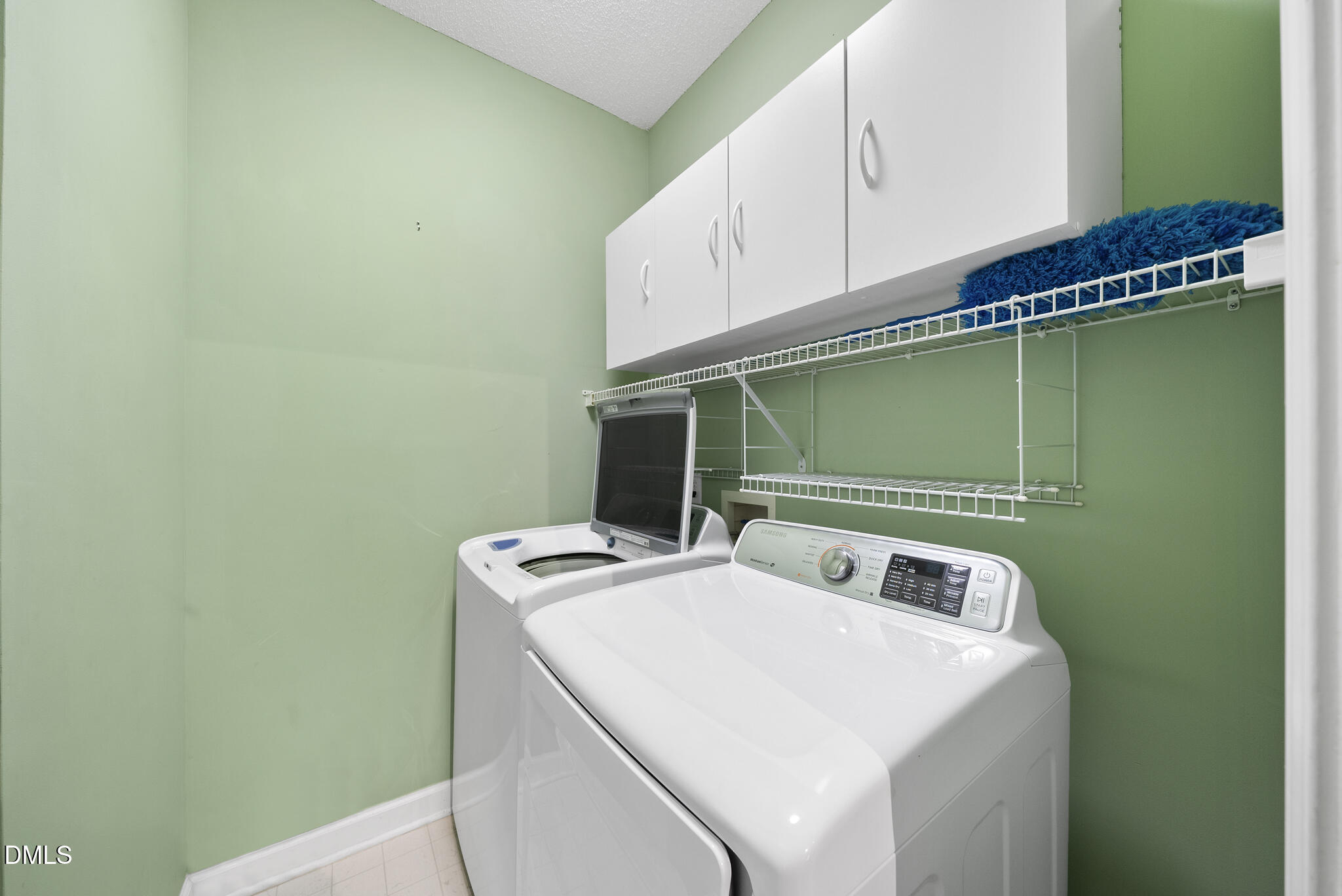 7710 Astoria Place Raleigh, NC 27612 - Photo 21 of 34 a utility room with dryer and washer