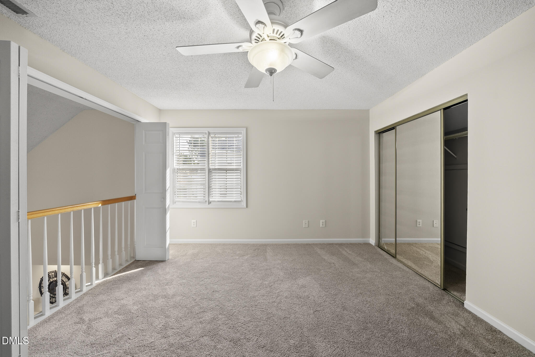 7710 Astoria Place Raleigh, NC 27612 - Photo 23 of 34 a view of an empty room with a window