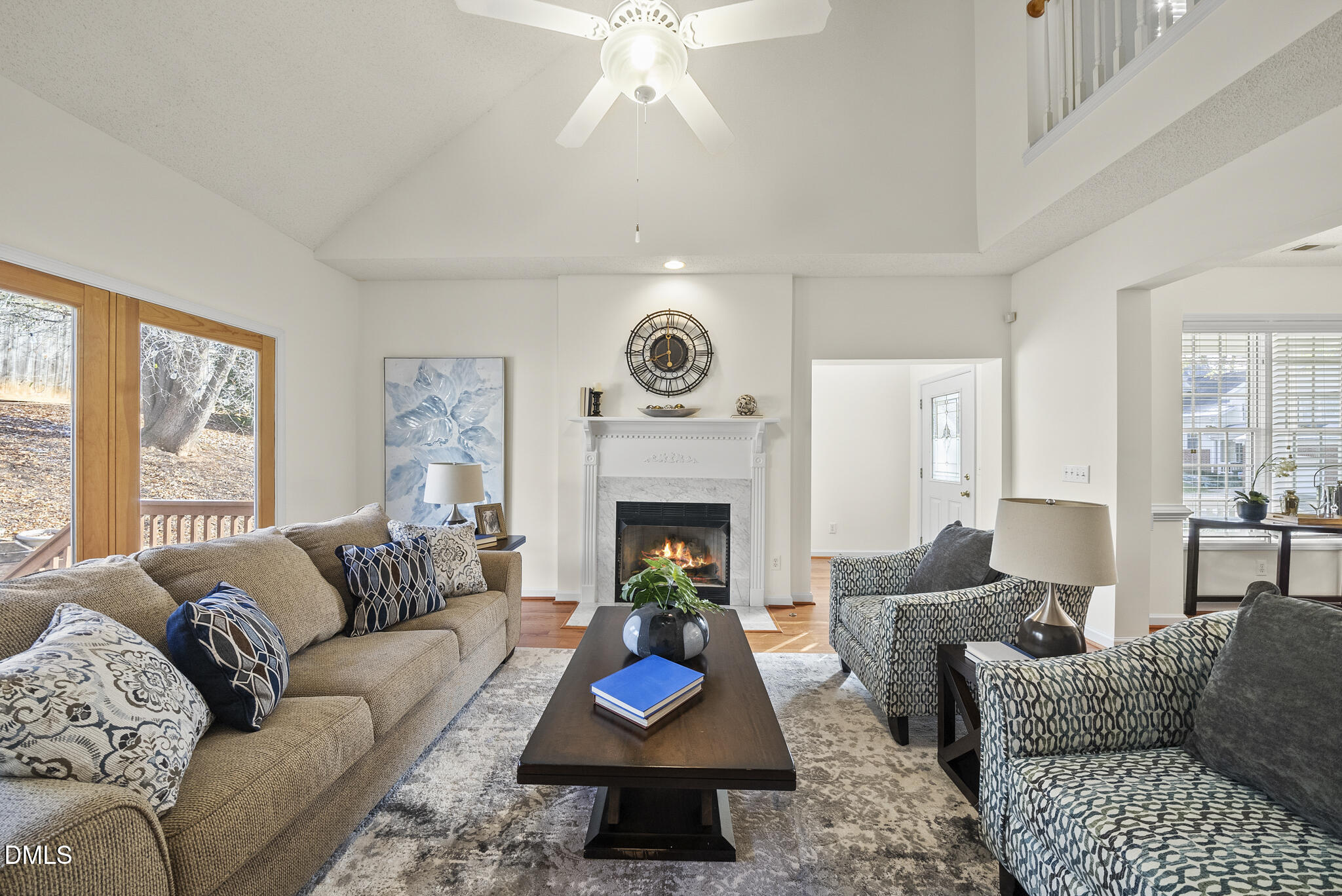 7710 Astoria Place Raleigh, NC 27612 - Photo 5 of 34 a living room with furniture and a fireplace
