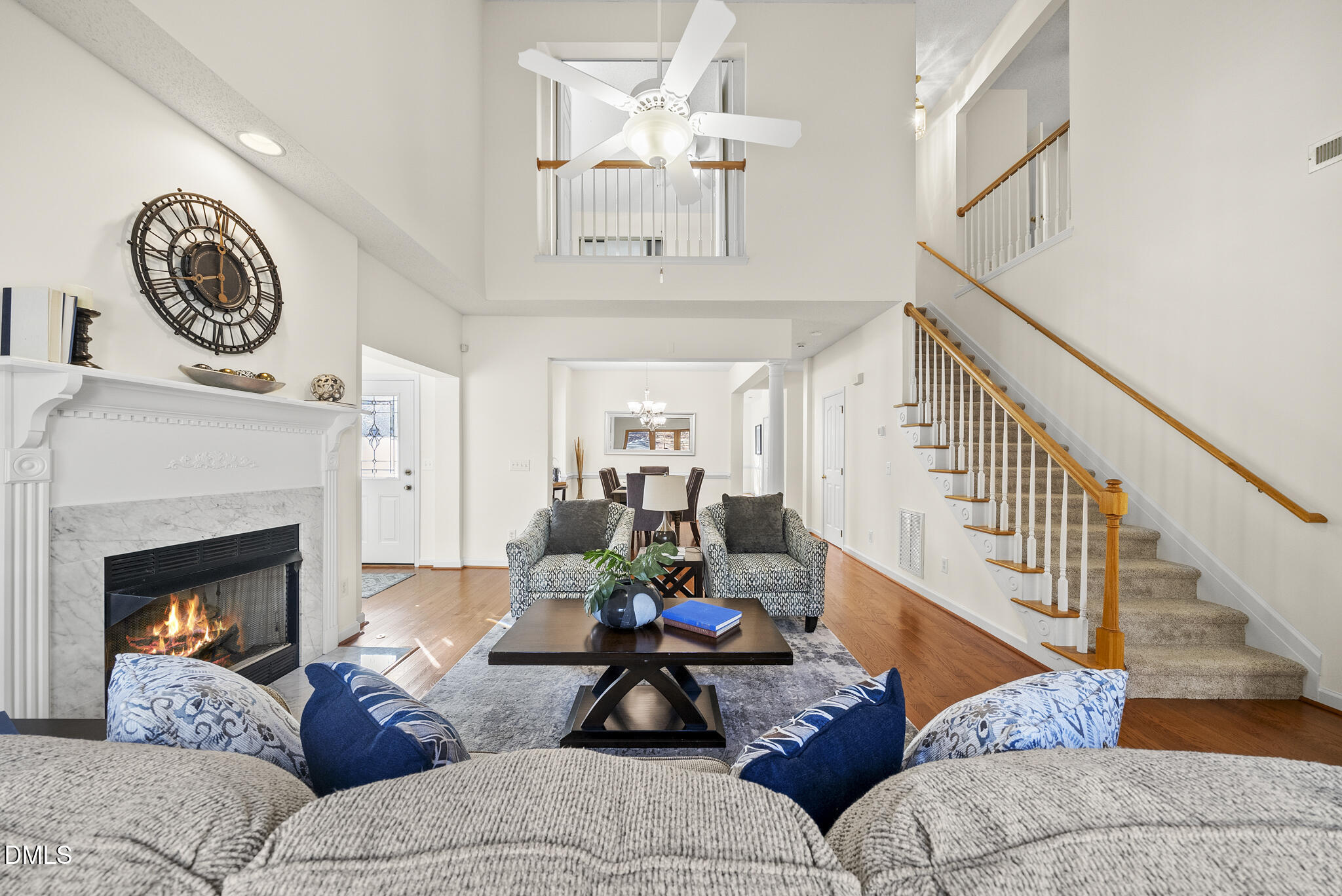 7710 Astoria Place Raleigh, NC 27612 - Photo 6 of 34 a living room with furniture and a fireplace