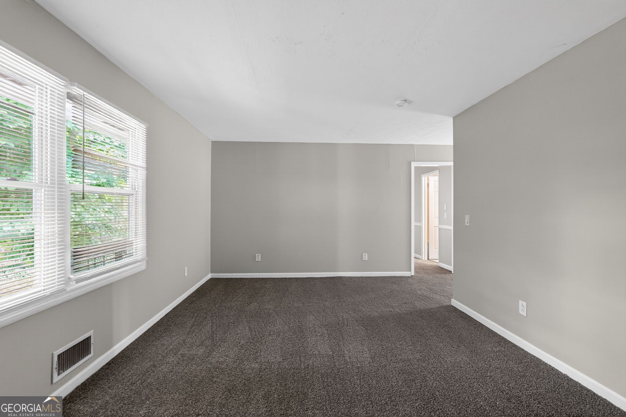 3285 Old Salem Road Southeast Conyers, GA 30013 - Photo 17 of 33 a view of an empty room with a window