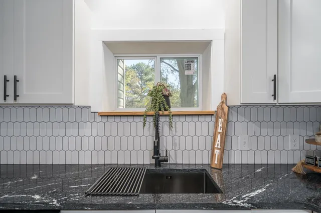 a view of a door with a bench