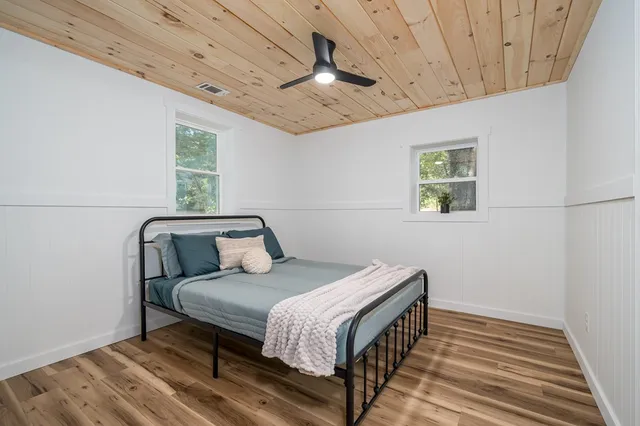 a bed room with a bed and a window