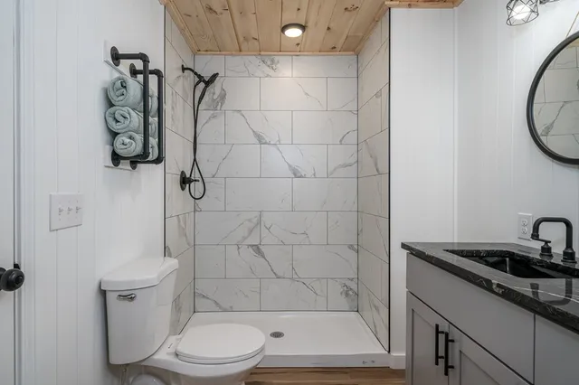 a bathroom with a toilet and shower