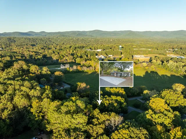 a view of a city with mountains in the background