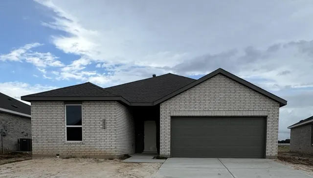 a front view of a house with a garage