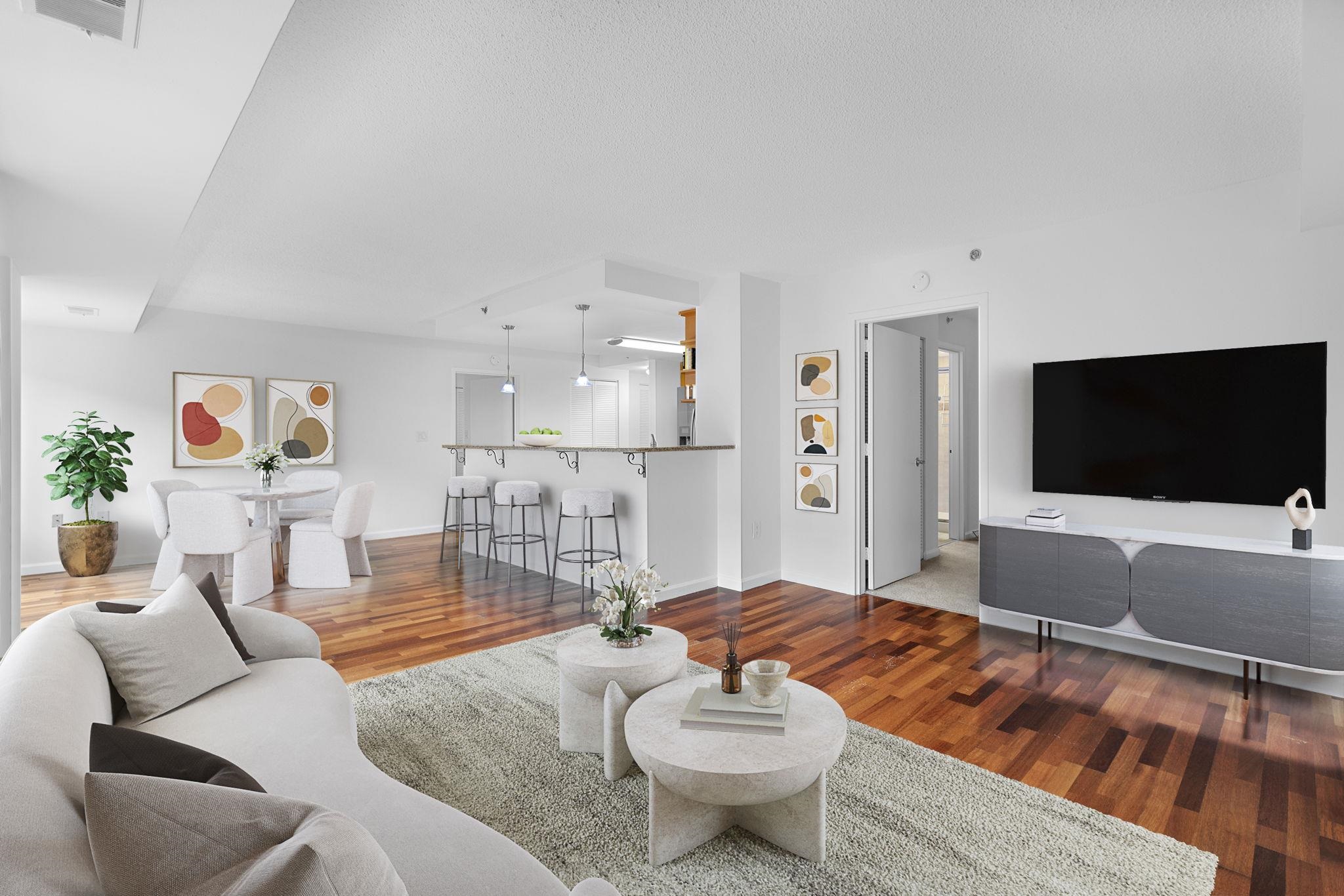 a living room with furniture and a flat screen tv