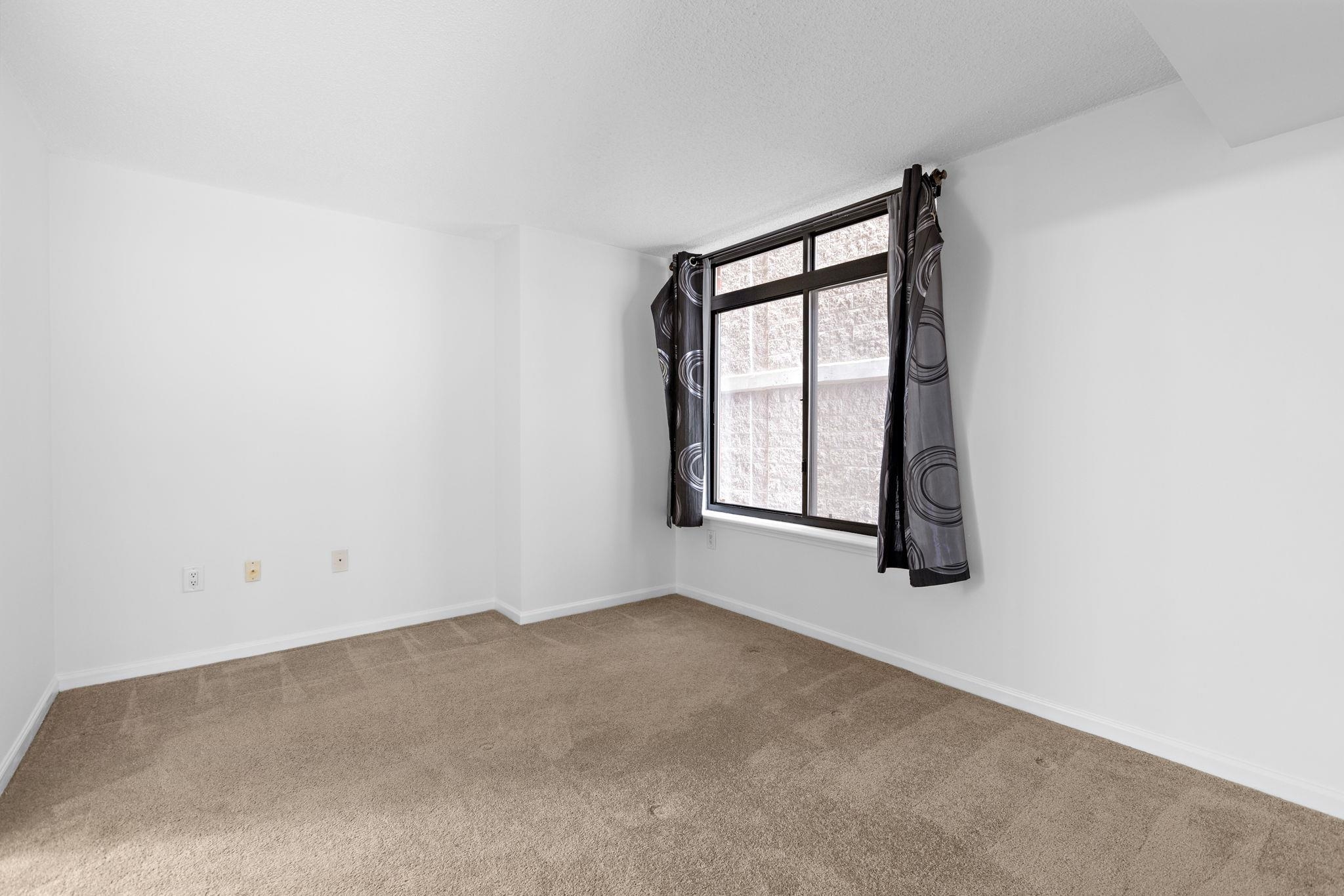 700 1st Street, Unit 3E Hoboken, NJ 07030 - Photo 13 of 16 an empty room with windows