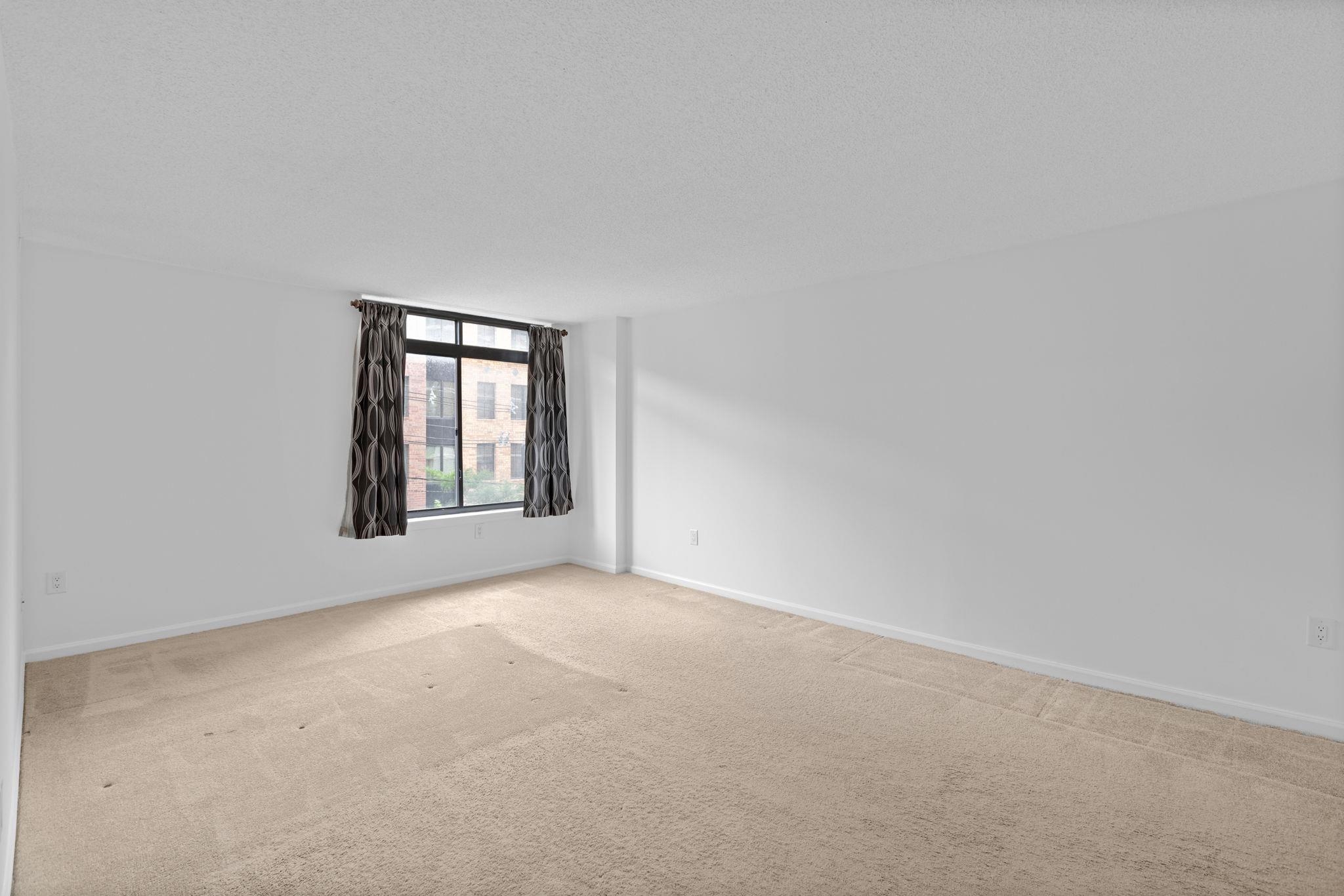 700 1st Street, Unit 3E Hoboken, NJ 07030 - Photo 14 of 16 a view of an empty room with a window