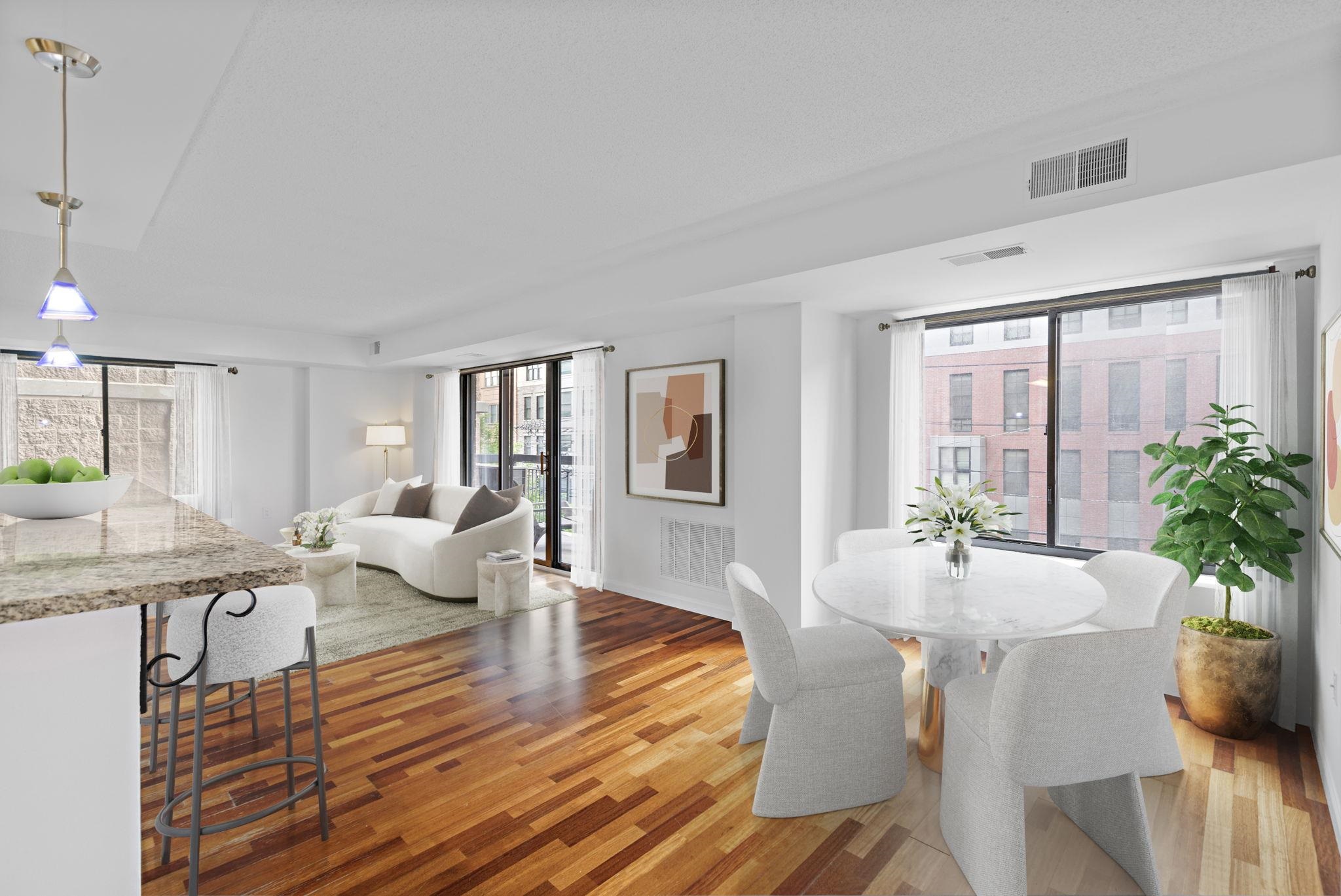 700 1st Street, Unit 3E Hoboken, NJ 07030 - Photo 2 of 16 a living room with furniture a large window and wooden floor