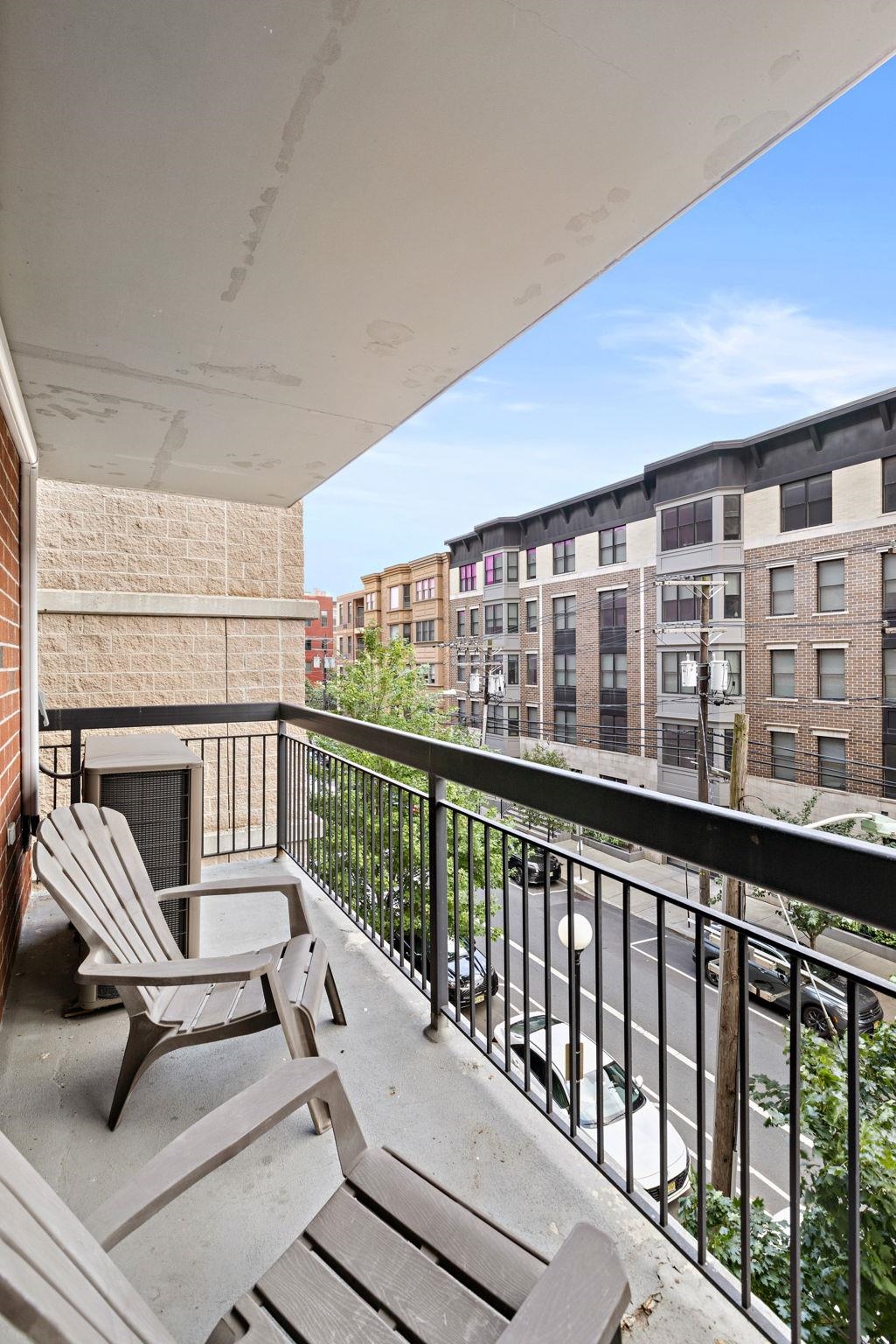 700 1st Street, Unit 3E Hoboken, NJ 07030 - Photo 9 of 16 a view of a balcony with chairs