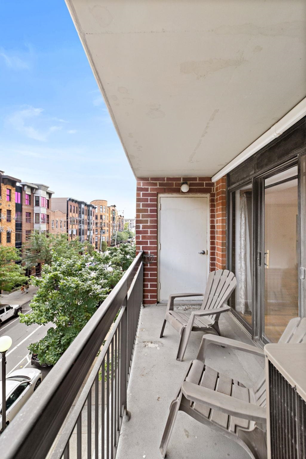 700 1st Street, Unit 3E Hoboken, NJ 07030 - Photo 10 of 16 a balcony view with couple of chairs