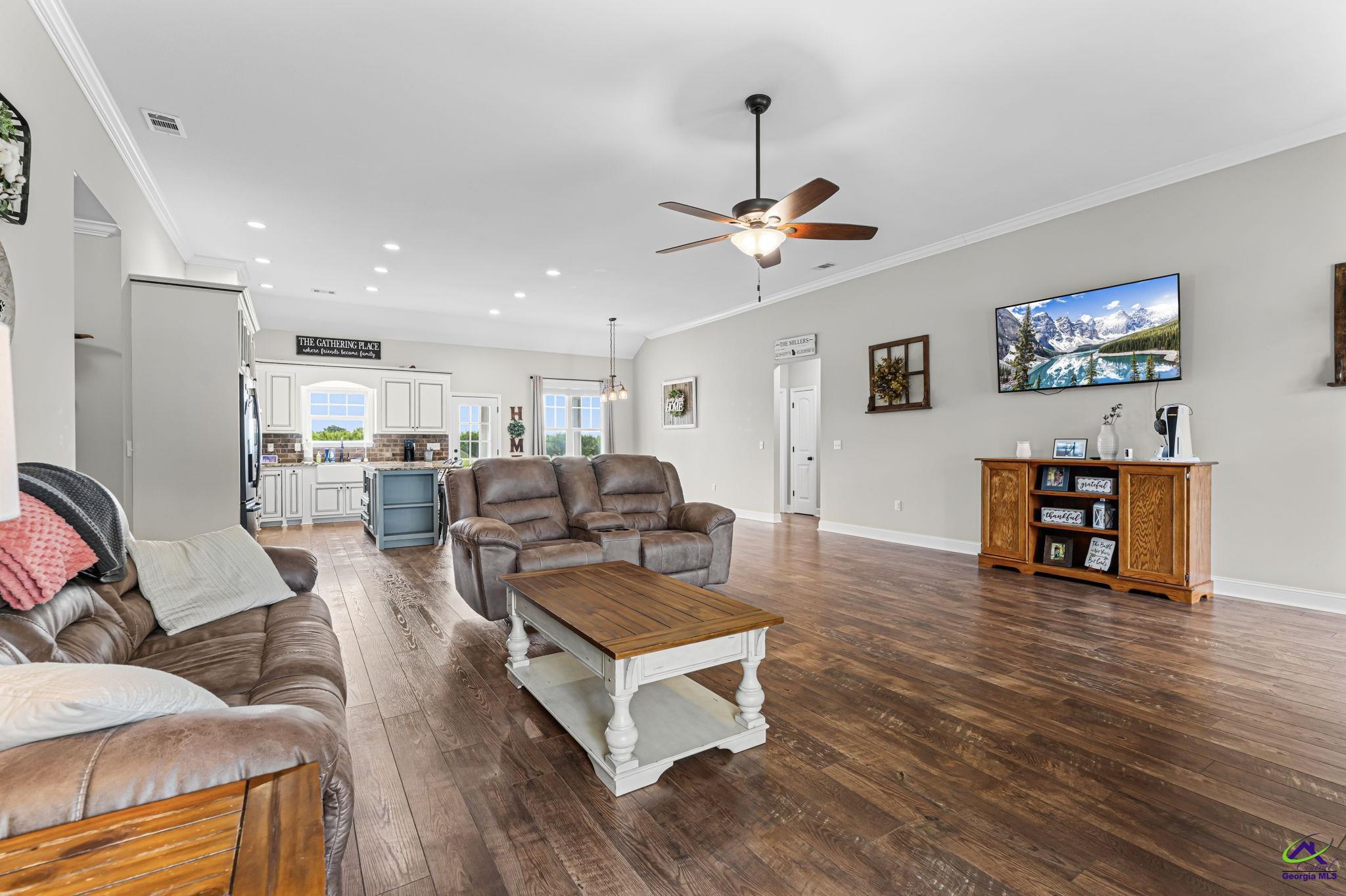 180 Woodland Trail Road Cochran, GA 31014 - Photo 6 of 25 a living room with furniture kitchen view and a wooden floor
