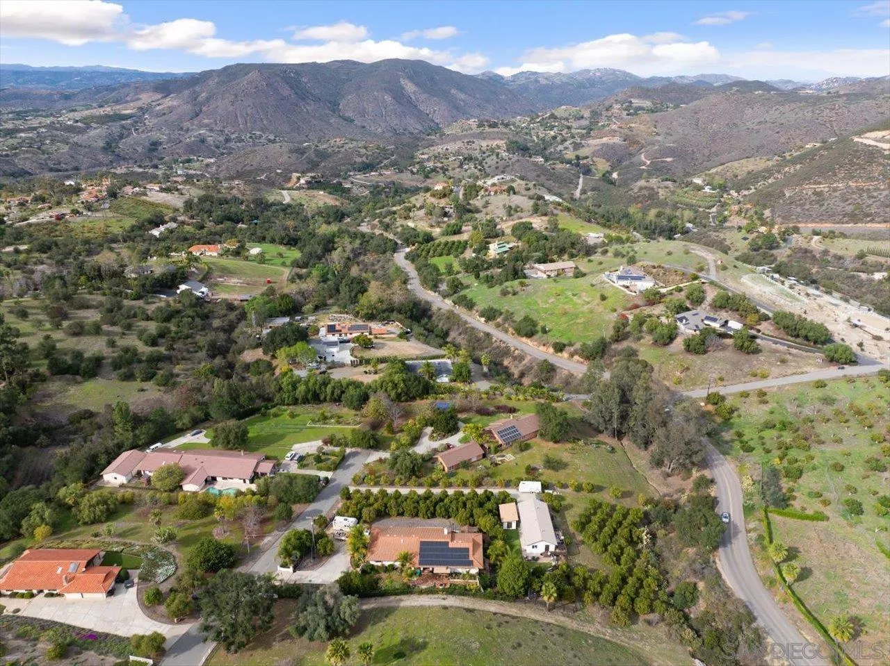 1379 Sunny Heights Road Fallbrook, CA 92028 - Photo 14 of 64 an aerial view of residential houses with outdoor space and trees