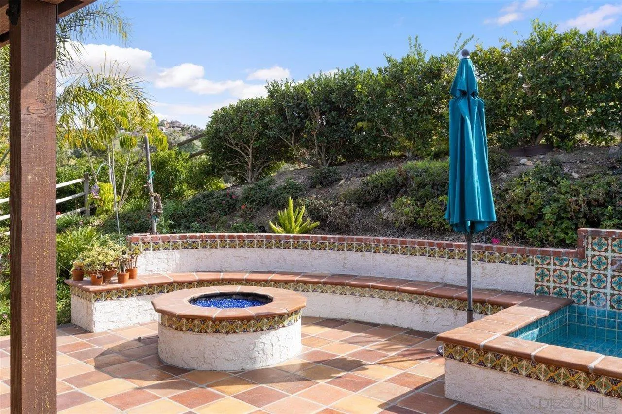1379 Sunny Heights Road Fallbrook, CA 92028 - Photo 16 of 64 a view of a patio with a table and chairs