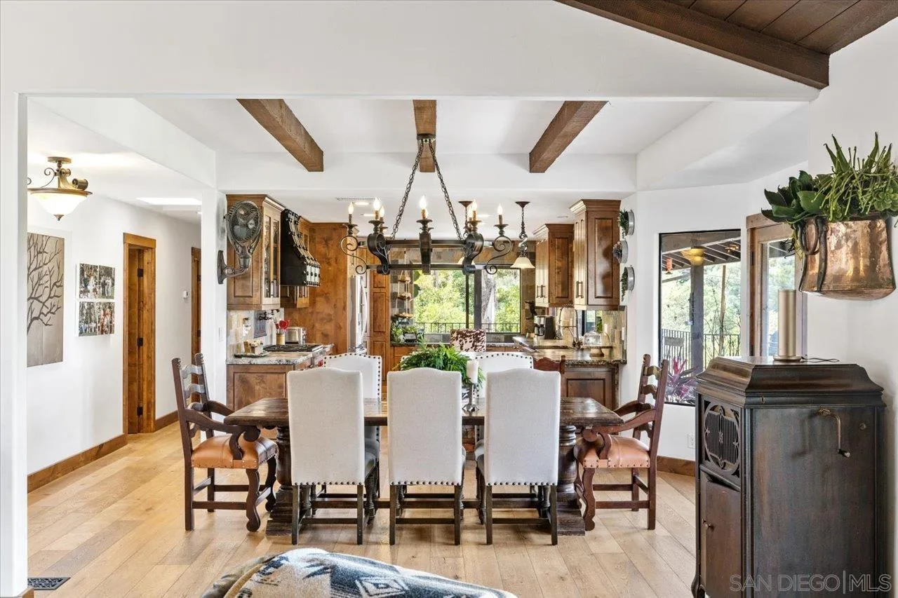 1379 Sunny Heights Road Fallbrook, CA 92028 - Photo 18 of 64 a view of a dining room with furniture window and wooden floor