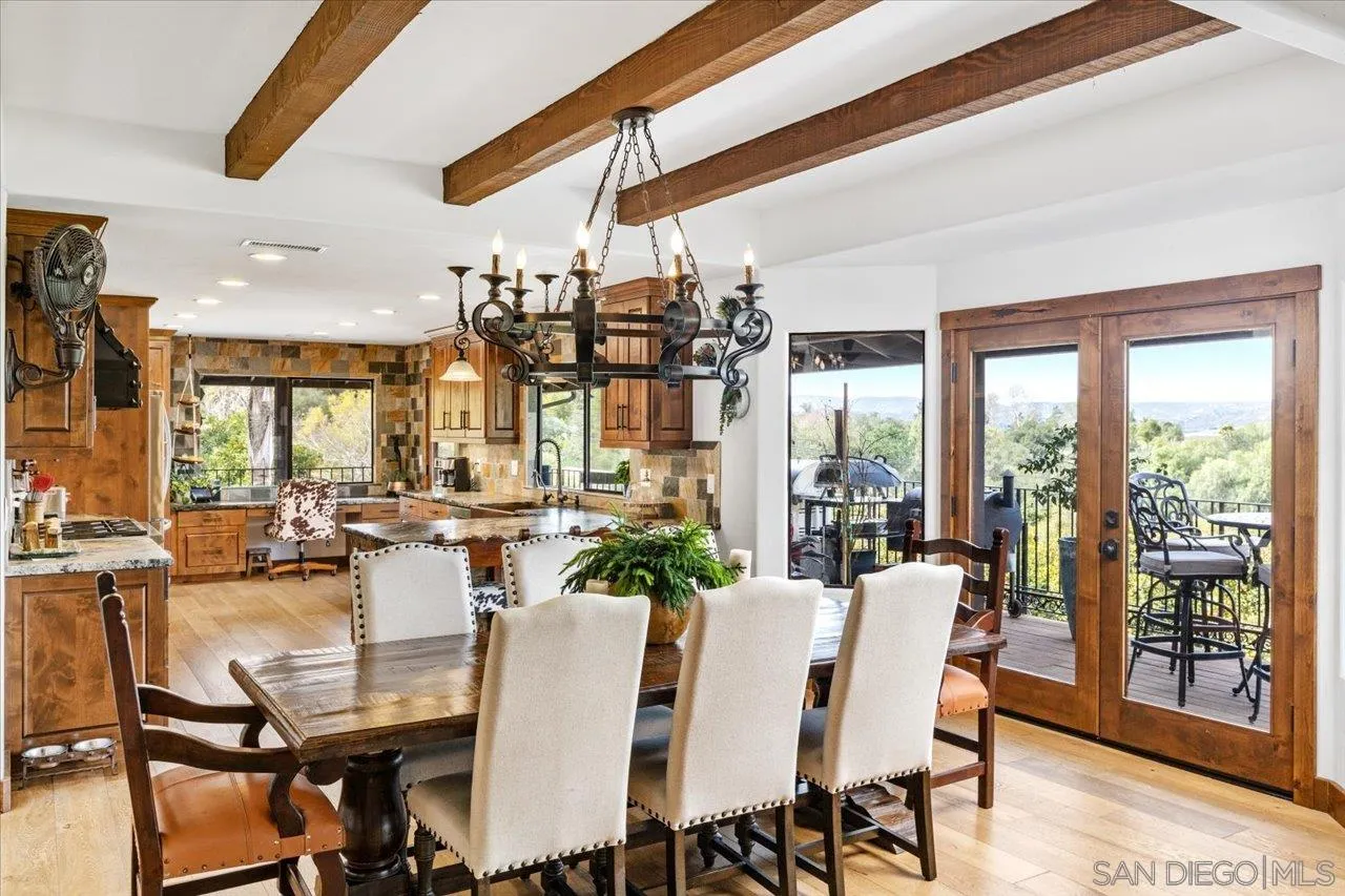 1379 Sunny Heights Road Fallbrook, CA 92028 - Photo 19 of 64 a view of a dining room with furniture wooden floor and chandelier