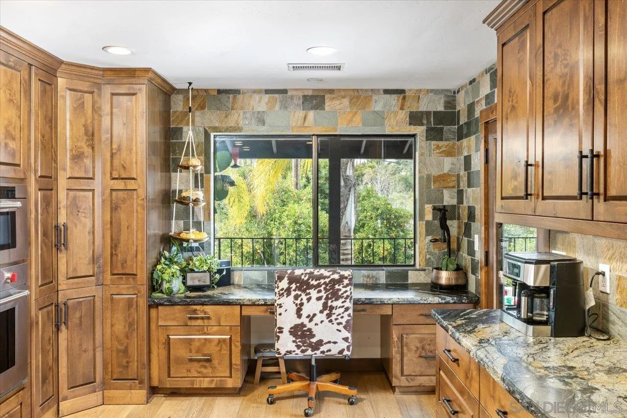 1379 Sunny Heights Road Fallbrook, CA 92028 - Photo 20 of 64 a living room with fireplace furniture and a floor to ceiling window
