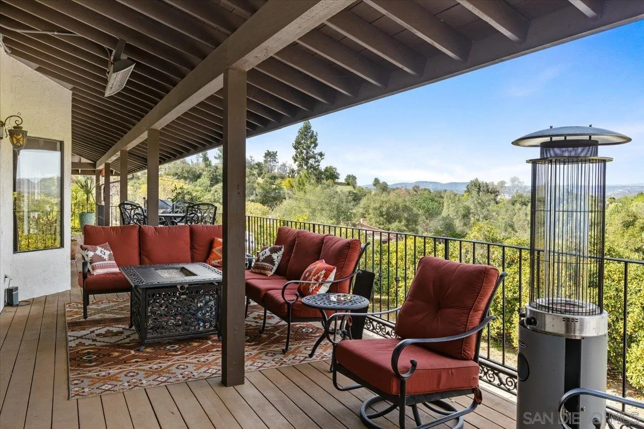 1379 Sunny Heights Road Fallbrook, CA 92028 - Photo 21 of 64 a view of a living room with furniture and wooden floor