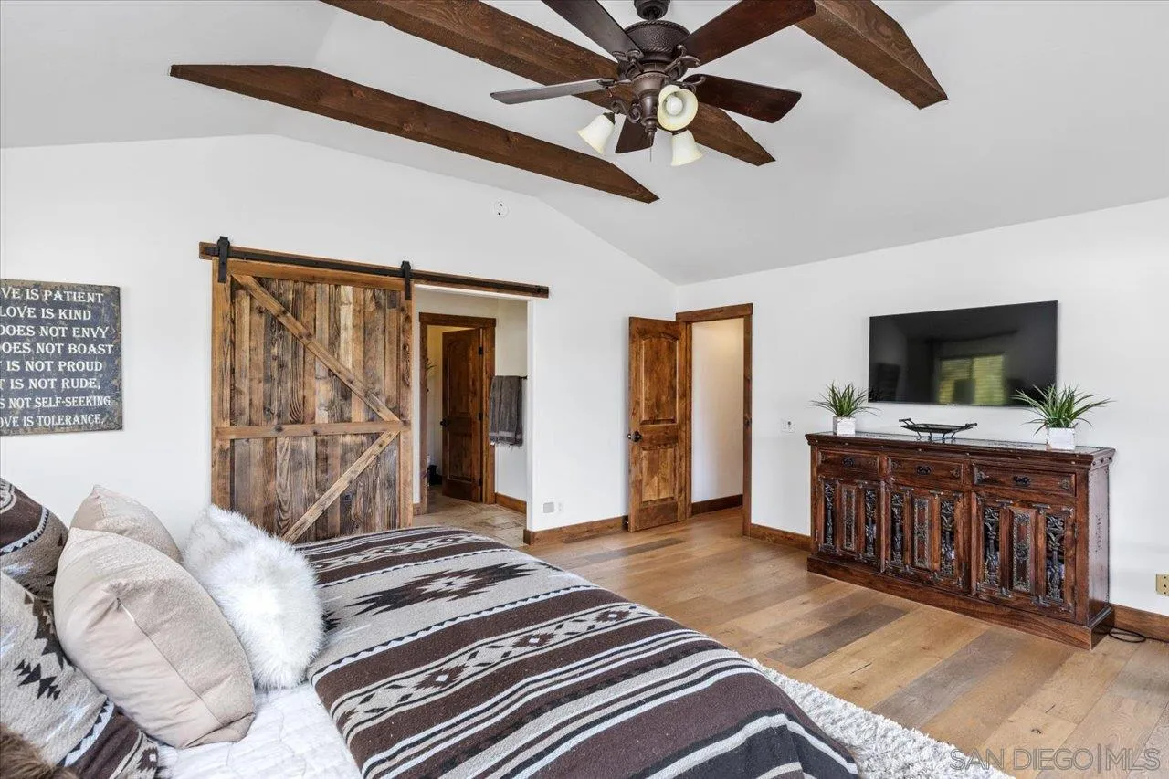 1379 Sunny Heights Road Fallbrook, CA 92028 - Photo 26 of 64 a living room with furniture and a flat screen tv