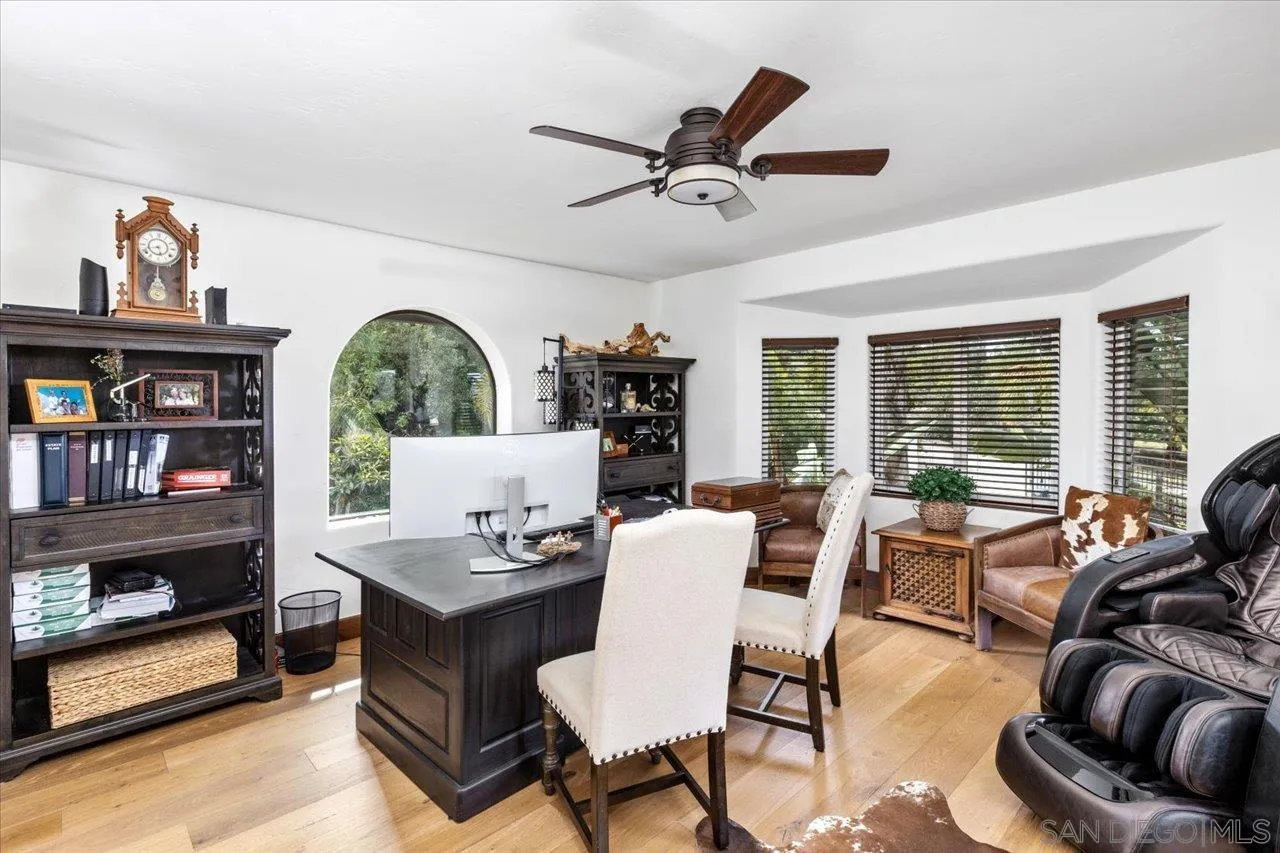 1379 Sunny Heights Road Fallbrook, CA 92028 - Photo 31 of 64 a living room with furniture and a book shelf