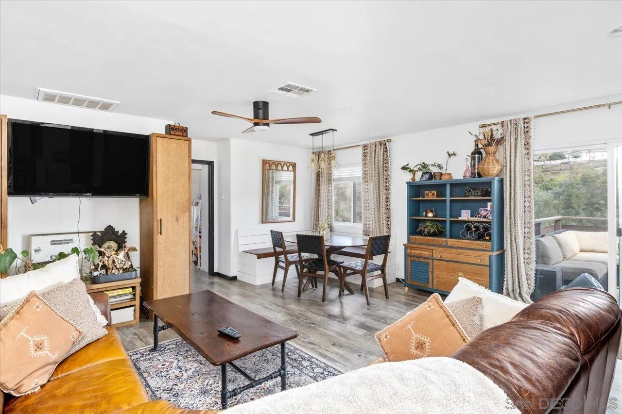 1379 Sunny Heights Road Fallbrook, CA 92028 - Photo 37 of 64 a living room with furniture and a flat screen tv