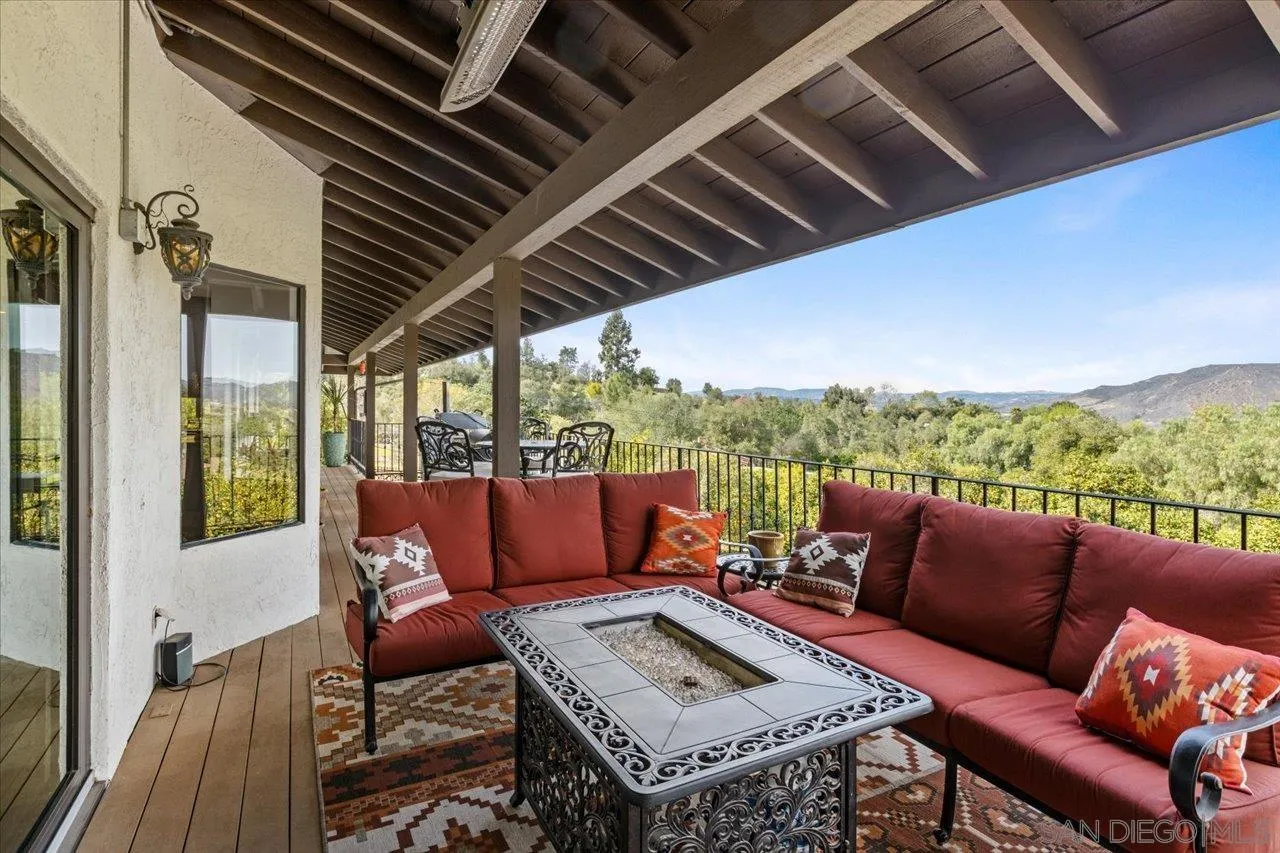 1379 Sunny Heights Road Fallbrook, CA 92028 - Photo 6 of 64 a roof deck with a table and chairs