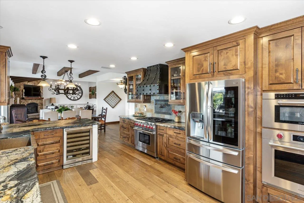 1379 Sunny Heights Road Fallbrook, CA 92028 - Photo 8 of 64 a kitchen with stainless steel appliances granite countertop a stove and a refrigerator