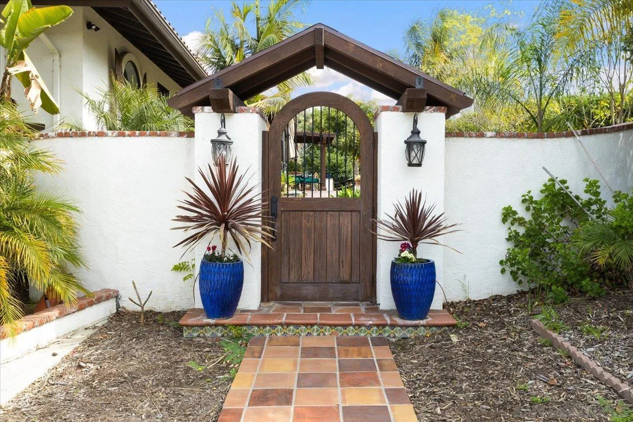 1379 Sunny Heights Road Fallbrook, CA 92028 - Photo 10 of 64 a view of a house with potted plants