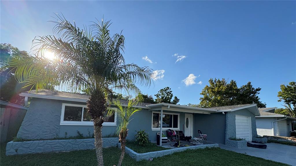 3841 Chaffey Drive New Port Richey, FL 34652 - Photo 2 of 2 a front view of a house with garden