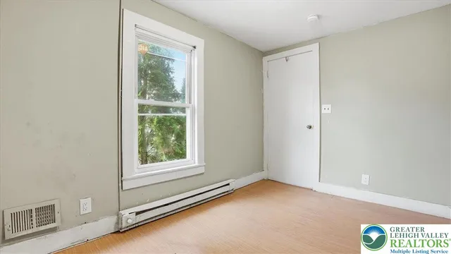 a view of an empty room with a window