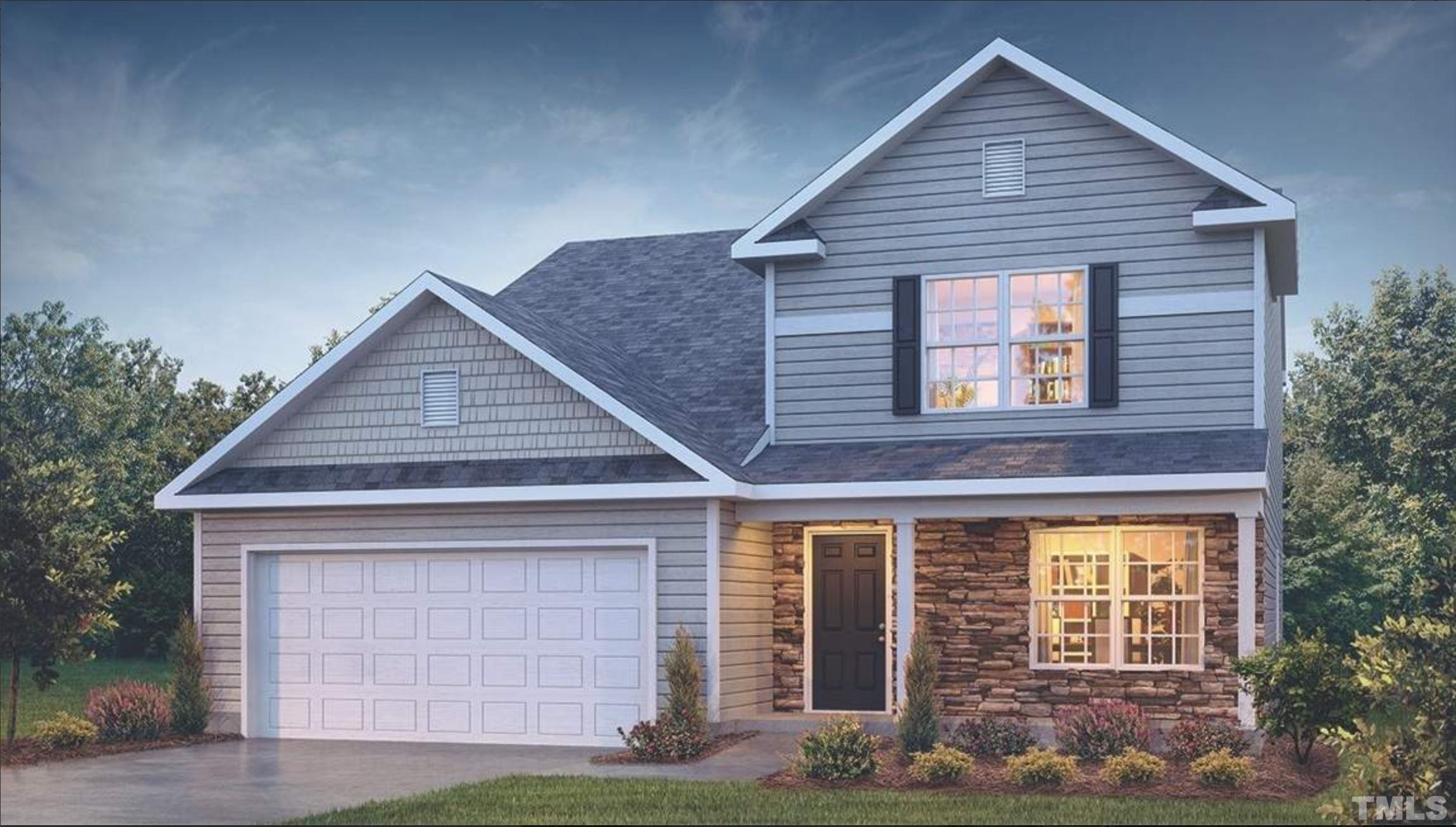 4032 Water Wheel Road Rocky Mount, NC 27803 - Photo 1 of 29 a front view of a house with garden
