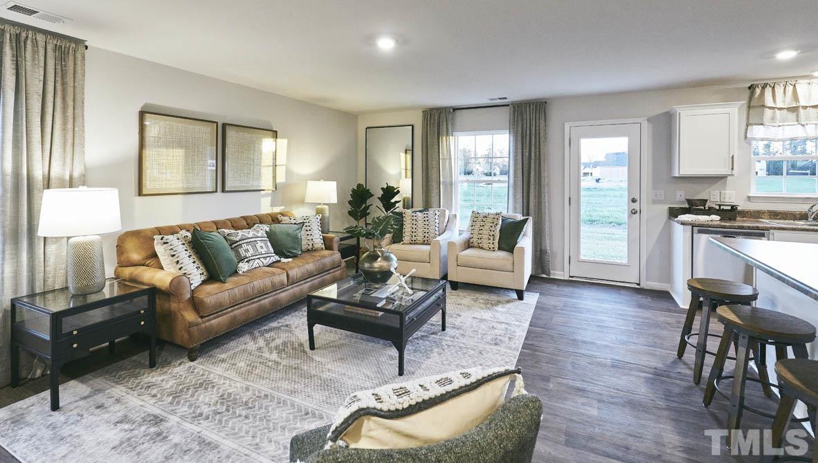 4032 Water Wheel Road Rocky Mount, NC 27803 - Photo 13 of 29 a living room with furniture or couch and a wooden floor