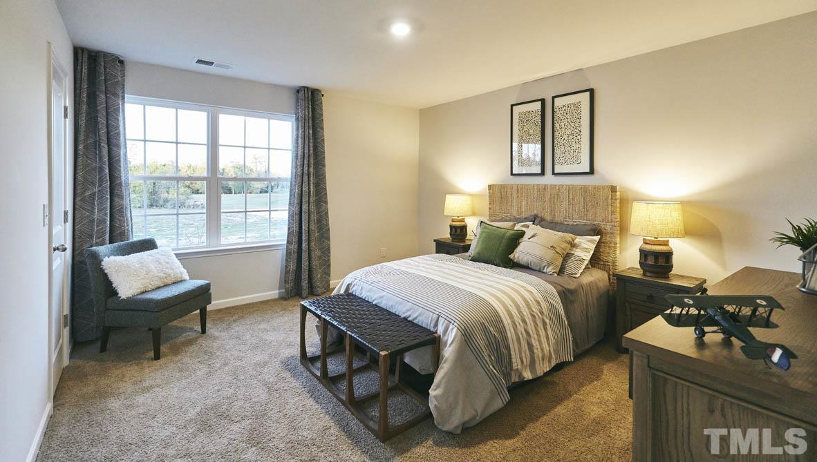 4032 Water Wheel Road Rocky Mount, NC 27803 - Photo 20 of 29 a bedroom with a bed and a window