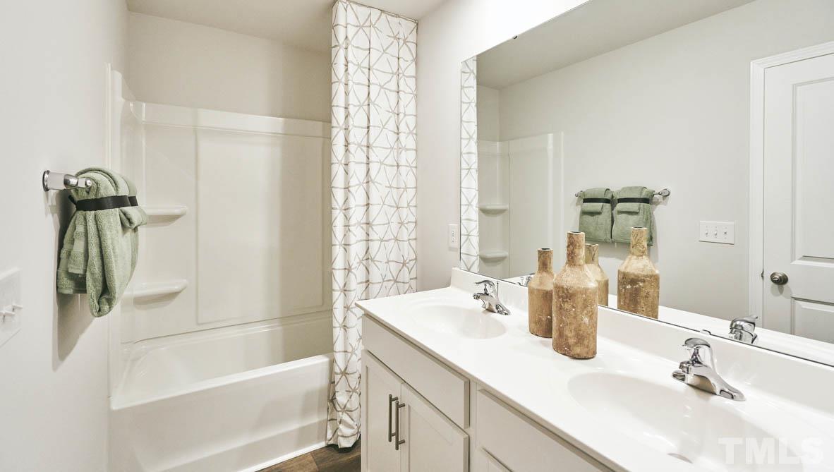 4032 Water Wheel Road Rocky Mount, NC 27803 - Photo 21 of 29 a bathroom with a sink and a bathtub