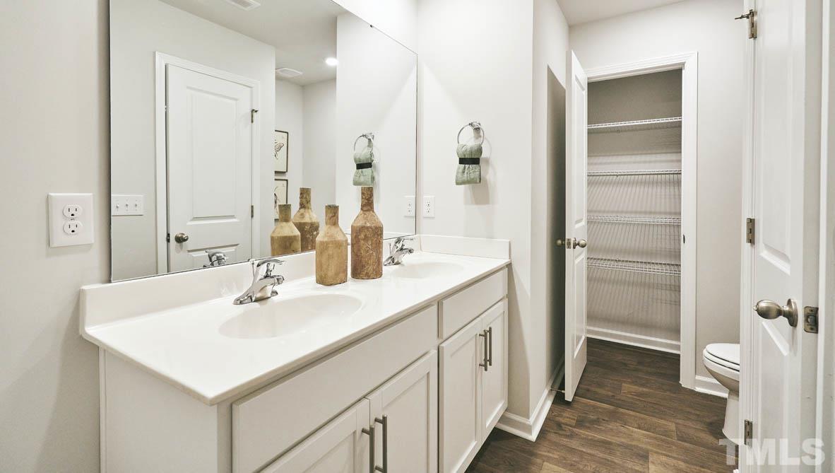 4032 Water Wheel Road Rocky Mount, NC 27803 - Photo 22 of 29 a bathroom with a sink a toilet and shower
