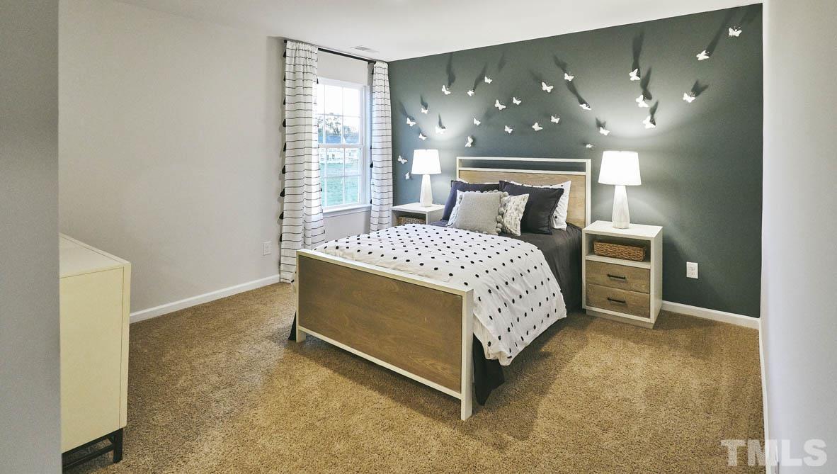 4032 Water Wheel Road Rocky Mount, NC 27803 - Photo 24 of 29 a bedroom with a bed and window