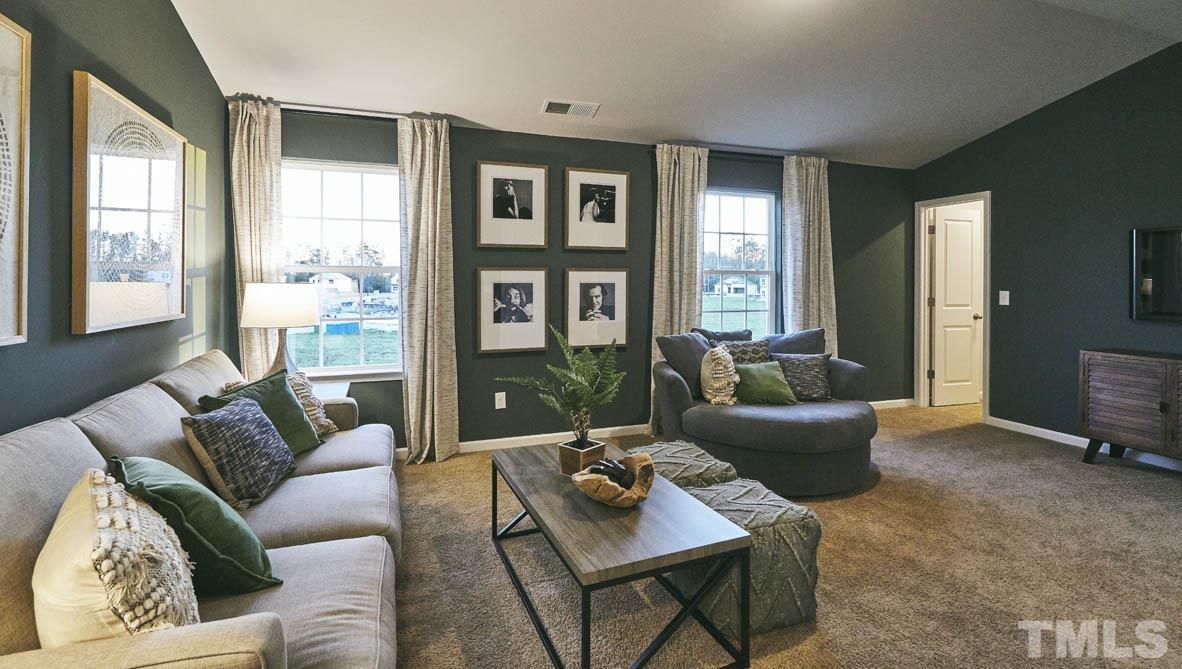 4032 Water Wheel Road Rocky Mount, NC 27803 - Photo 25 of 29 a living room with furniture and a large window