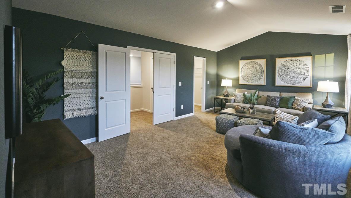 4032 Water Wheel Road Rocky Mount, NC 27803 - Photo 27 of 29 a living room with furniture and a large window
