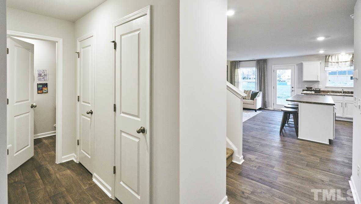 4032 Water Wheel Road Rocky Mount, NC 27803 - Photo 4 of 29 a view of a kitchen from the hallway with a livingroom