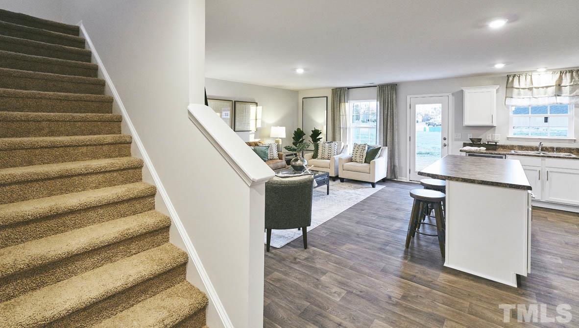 4032 Water Wheel Road Rocky Mount, NC 27803 - Photo 5 of 29 a living room with furniture and a wooden floor
